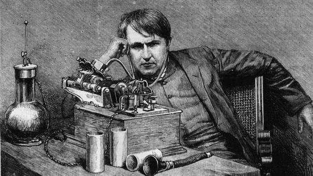 Thomas Edison listening to a primitive version of headphones circa 1871. (Image: Getty)